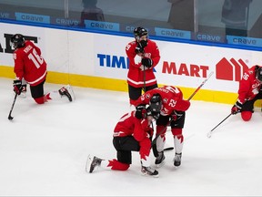 Team Canada players react to their world junior gold-medal loss to Team USA on Tuesday night in Edmonton.