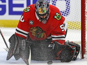Corey Crawford of the Blackhawks makes a save against the Jets at the United Center on Dec. 14, 2018 in Chicago.