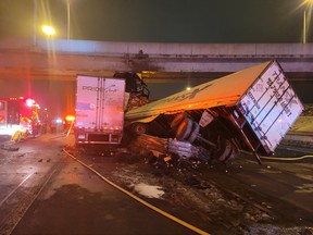 Two transport trucks are seen in the eastbound lanes of Hwy. 401 at Allen Rd. on Tuesday, Jan. 5, 2021.