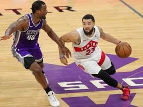 Toronto Raptors guard Fred VanVleet dribbles the ball against Sacramento Kings forward Harrison Barnes during the second quarter at Golden 1 Center on Jan. 8, 2021.