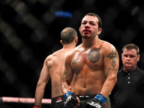 Irwin Rivera of the United States looks on during the fight against Giga Chikadze (L) of Georgia in their Featherweight bout during UFC Fight Night at VyStar Veterans Memorial Arena on May 16, 2020 in Jacksonville, Florida.