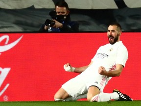 Real Madrid's Karim Benzema celebrates scoring their second goal against Athletic Bilbao in Madrid, Spain, Dec. 15, 2020.