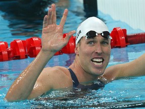 In this file photo taken on August 12, 2008, U.S. swimmer Klete Keller smiles after winning the men's 4 x 200m freestyle relay at the Beijing Olympic Games. The New York Times and SwimSwam, a swimming news website, reported on Keller being among the supporters of President Donald Trump who fought their way into the Capitol last Wednesday in a violent election protest. (Photo by Greg WOOD / AFP) (Photo by GREG WOOD/AFP via Getty Images)