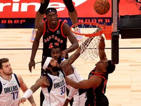 Raptors’ Kyle Lowry (right) shoots over Dallas’ Willie Cauley-Stein at Amalie Arena in Tampa last night. The Raptors won 116-93.  Mike Ehrmann/Getty Images