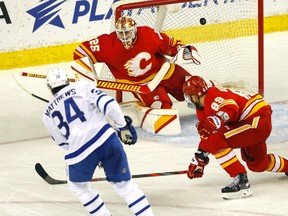 Maple Leafs centre Auston Matthews beats Calgary Flames goalie Jacob Markstrom on a power play in the first on Tuesday night at the Scotiabank Saddledome in Calgary.