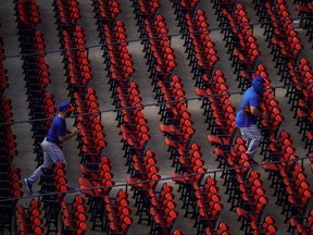 Players for the New York Mets head off the field after warm ups before the start of the game against the Boston Red Sox at Fenway Park in Boston, July 28, 2020.