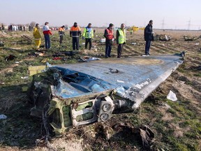 A handout photo provided by the Iranian news agency IRNA on Jan. 8, 2020, shows rescue teams working at the scene of a Ukrainian airliner that crashed shortly after take-off near Imam Khomeini airport in the Iranian capital Tehran.