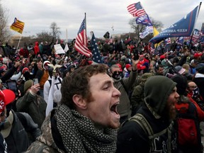 A mob of supporters of U.S. President Donald Trump storm the U.S. Capitol Building in Washington, D.C., Jan. 6, 2021.