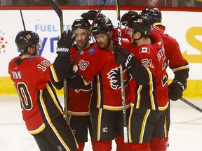 Calgary Flames Oliver Kylington scores on Carolina Hurricanes goalie, Petr Mrazek in first period action at the Scotiabank Saddledome in Calgary on Tuesday January 22, 2019. Darren Makowichuk/Postmedia