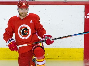 Calgary Flames forward Sam Bennett stretches before practice on the the first day of training camp in Calgary on Monday, Jan. 4, 2021.