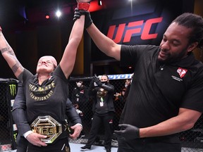 June 6, 2020; Las Vegas, NV, USA; Amanda Nunes of Brazil celebrates after her unanimous-decision victory over Felicia Spencer of Canada in their UFC featherweight championship bout during UFC 250 at the UFC APEX. Mandatory Credit: Jeff Bottari/Zuffa LLC via USA TODAY Sports