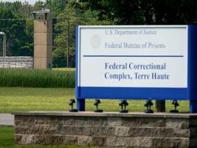 A correction officer keeps watch from a tower at The Federal Corrections Complex in Terre Haute, Indiana, May 22, 2019.