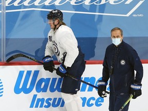 Patrik Laine leaves the ice early after speaking to Jets head coach Paul Maurice at practice in Winnipeg on Sunday. He was not on the ice at all in Ottawa on Tuesday, but was out for a short skate Wednesday.