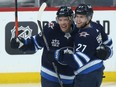 Winnipeg Jets centre Paul Stastny (left) celebrates his goal against the Edmonton Oilers in Winnipeg with Nikolaj Ehlers on Tues., Jan. 26, 2021. Kevin King/Winnipeg Sun/Postmedia Network