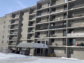 A security vehicle is parked outside Lancelot Apartments in North Bay Tuesday, Feb. 9, 2021 after a COVID-19 community outbreak was declared at the building.