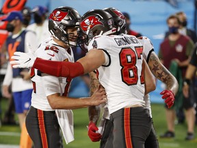 Tampa Bay Buccaneers’ Rob Gronkowski celebrates scoring a touchdown with Tom Brady (left) during the Super Bowl.