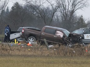 Investigators examine the scene on County Road 17 in Kawartha Lakes, Ont.,on Friday, Nov. 27, 2020.