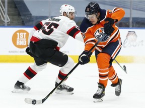 Edmonton Oilers' Jesse Puljujarvi (13) beats Ottawa Senators' Braydon Coburn (55) to score a goal during first period NHL action at Rogers Place in Edmonton, on Tuesday, Feb. 2, 2021.