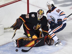 Calgary Flames goalie Jacob Markstrom (25) stops a shot from Edmonton Oilers forward Kailer Yamamoto (56) during the second period at Scotiabank Saddledome on Feb. 6,2021.