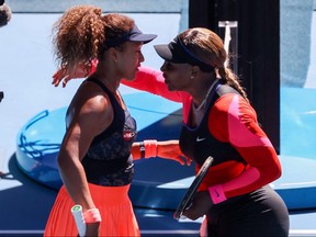 Japan's Naomi Osaka, left, greets Serena Williams of the United States at the end of their Australian Open women's singles semifinal match in Melbourne on Feb. 18, 2021.
