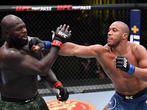 In this handout image provided by UFC, Ciryl Gane, right, of France punches Jairzinho Rozenstruik of Suriname in a heavyweight bout during the UFC Fight Night event at UFC APEX on Feb. 27, 2021 in Las Vegas, Nevada.