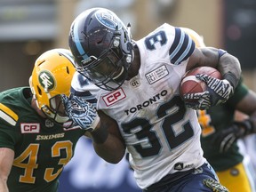 Toronto Argonauts running back James Wilder Jr. (right) rushes against the Edmonton Football Team in this file photo taken in Toronto on Sept. 16, 2017.