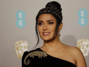 Salma Hayek poses on the red carpet upon arrival at the BAFTA British Academy Film Awards at the Royal Albert Hall in London on Feb. 10, 2019.