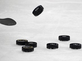 LAS VEGAS, NEVADA - FEBRUARY 05: Hockey pucks are shown on the ice during warmups before a game between the Los Angeles Kings and the Vegas Golden Knights at T-Mobile Arena on February 5, 2021 in Las Vegas, Nevada. The Golden Knights defeated the Kings 5-2. (Photo by Ethan Miller/Getty Images)