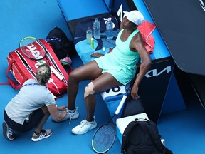 Venus Williams seeks treatment during a medical time-out for an injury in her second round match against Sara Errani of Italy during day three of the 2021 Australian Open at Melbourne Park on Feb. 10, 2021 in Melbourne, Australia.