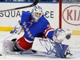 New York Rangers goaltender Henrik Lundqvist makes a glove save against the Carolina Hurricanes at Madison Square Garden.