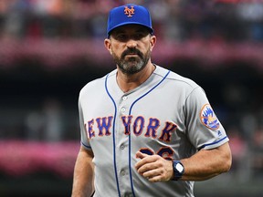 New York Mets manager Mickey Callaway walks back to the dugout after making a pitching change against the Philadelphia Phillies at Citizens Bank Park.