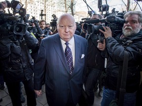 Suspended senator Mike Duffy arrives for his first court appearance at the courthouse in Ottawa on Tuesday, April 7, 2015.