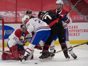 Senators winger Brady Tkachuk (7) looks for a loose puck in front of Montreal Canadiens goalie Carey Price during the second period on Tuesday night at the Canadian Tire Centre. Tkachuk had two goals in the game.