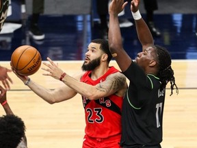 Raptors guard Fred VanVleet goes up for a shot past Minnesota Timberwolves centre Naz Reid at Target Centre last night. USA TODAY