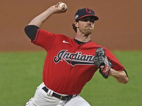 Cleveland Indians pitcher Shane Bieber (57) delivers in Game 1 of an American League wild-card series against the New York Yankees, Tuesday, Sept. 29, 2020, in Cleveland.