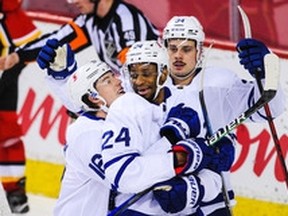 Wayne Simmonds (centre) is congratulated by teammates after scoring against Calgary in late January. Simmonds scored in each of the Leafs’ first three games of a four-game trip through Alberta last week, with two goals coming on the power play.