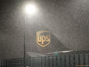 Snow falls at the UPS WorldPort hub located at Louisville Muhammad Ali International Airport in Louisville, Kentucky, Monday, Feb. 15, 2021.