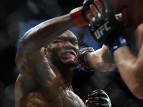 UFC welterweight champion Kamaru Usman, left, trades punches with Colby Covington in their welterweight title fight during UFC 245 at T-Mobile Arena on Dec. 14, 2019 in Las Vegas, Nevada.