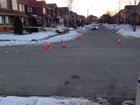 Evidence markers are seen after a shooting in Brampton early Thursday morning that left a 22-year-old man in life-threatening condition.