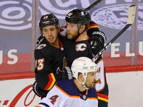 Calgary Flames Sam Bennett celebrates with teammates after scoring a goal against the Edmonton Oilers during NHL hockey in Calgary on Saturday February 6, 2021. Al Charest / Postmedia