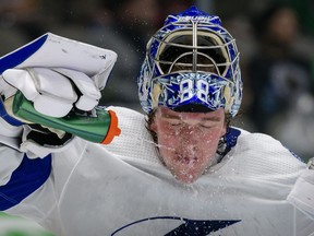 Tampa Bay Lightning goaltender Andrei Vasilevskiy sprays his face with water on Tuesday night.