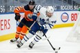 Edmonton Oilers’ James Neal chases Toronto Maple Leafs’ Morgan Reilly during Wednesday's game.