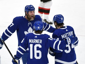 Toronto Maple Leafs forward Joe Thornton (left) celebrates a goal with teammates last month.