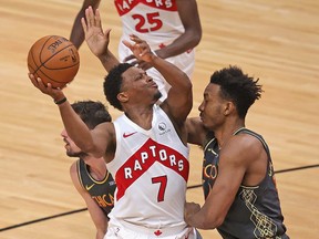 Kyle Lowry #7 of the Toronto Raptors tries to get off a shot against Wendell Carter Jr. #34 of the Chicago Bulls at the United Center on Sunday.