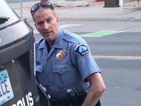 This still image taken from a May 25, 2020, video courtesy of Darnella Frazier via Facebook, shows a Minneapolis, Minnesota, police officer Derek Chauvin restraining George Floyd (not pictured).