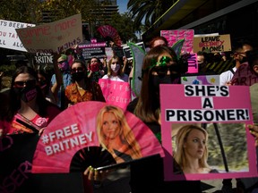 TOPSHOT - Supporters of the FreeBritney movement rally in support of musician Britney Spears following a conservatorship court hearing in Los Angeles, California on March 17, 2021. - Free Britney supporters of fans of Spears have closely followed her conservatorship case and rallied that the pop singer should be legally allowed to decide her own affairs. (Photo by Patrick T. FALLON / AFP) (Photo by PATRICK T. FALLON/AFP via Getty Images)