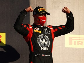 Race winner Nikita Mazepin of Russia and Hitech Grand Prix celebrates on the podium during the Formula 2 Championship Feature Race at Mugello Circuit on September 12, 2020 in Scarperia, Italy.