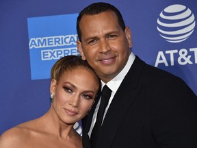 In this file photo taken on January 2, 2020 Jennifer Lopez and partner Alex Rodriguez arrive for the 31st Annual Palm Springs International Film Festival (PSIFF) Awards Gala at the Convention Center in Palm Springs, California.