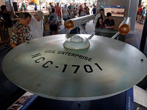 Visitors to the Smithsonian Air and Space Museum see the fully restored original USS Enterprise model from the 1960s "Star Trek" TV series in Washington July 7, 2016.