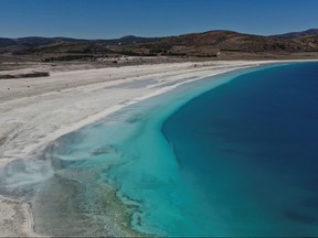 A general view of Salda Lake in Burdur province, Turkey, March 1, 2021. The official Twitter account of NASA Earth mentioned lake Salda in their tweet a day before NASA rover Perseverance touched down on Mars. Picture taken with a drone on March 1, 2021. REUTERS/Umit Bektas ORG XMIT: HFS-ANK18